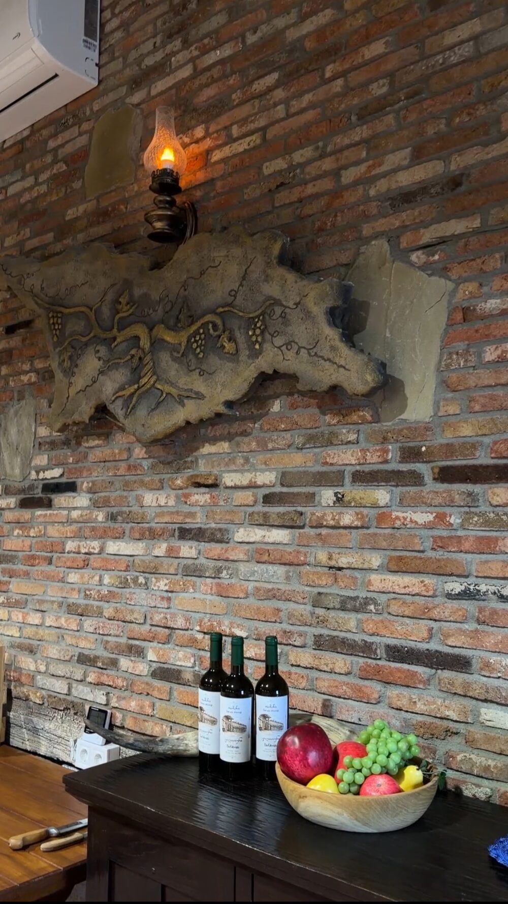 Tamani Estate Tsolikouri bottles displayed at the winery